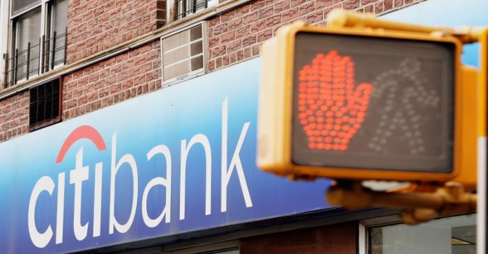 FILE PHOTO: Pedestrian signals can be seen outside of a Citibank branch in New York