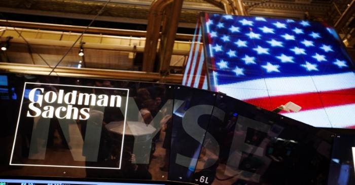 FILE PHOTO: The Goldman Sachs logo is displayed on a post above the floor of the New York Stock