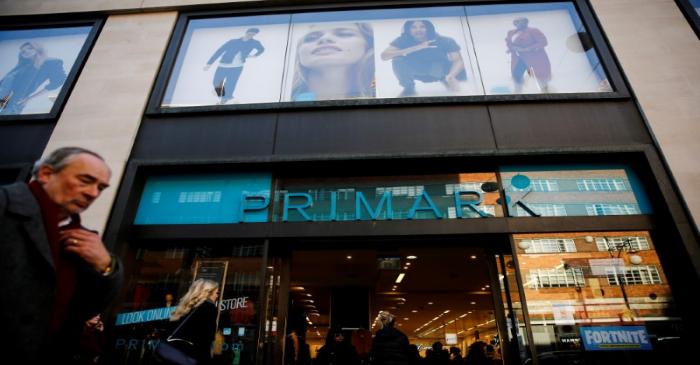 FILE PHOTO: Shoppers walk past a Primark store on Oxford Street in London