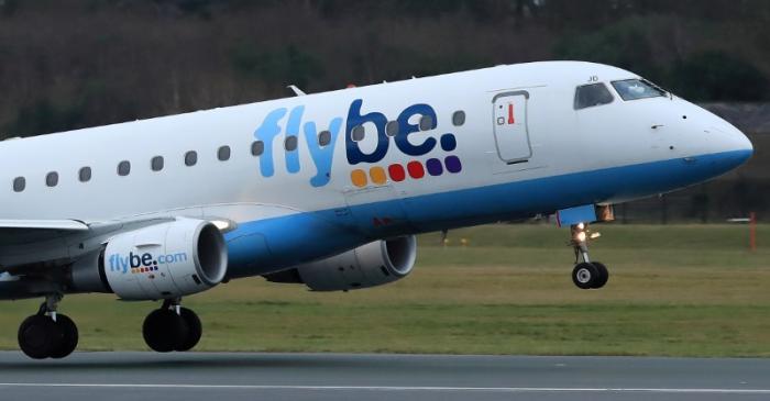 FILE PHOTO: A Flybe plane takes off from Manchester Airport in Manchester, Britain