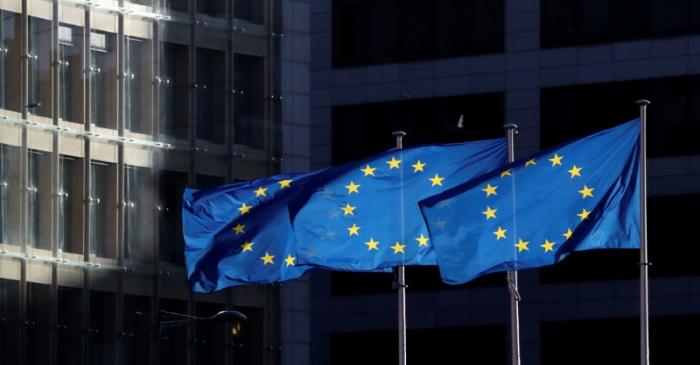 European Union flags fly outside the European Commission headquarters in Brussels