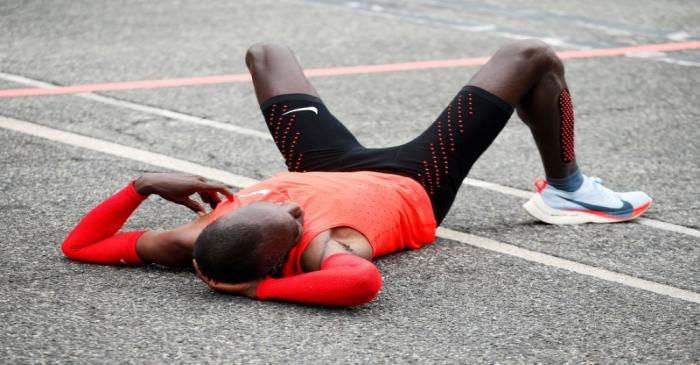 FILE PHOTO: Kipchoge reacts after crossing  the finish line during an attempt to break the