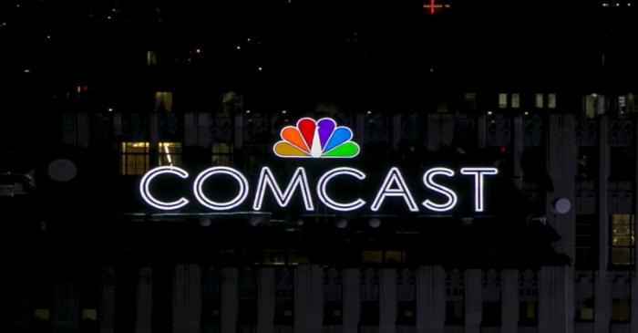 FILE PHOTO: The NBC and Comcast logo are displayed on top of 30 Rockefeller Plaza, formerly