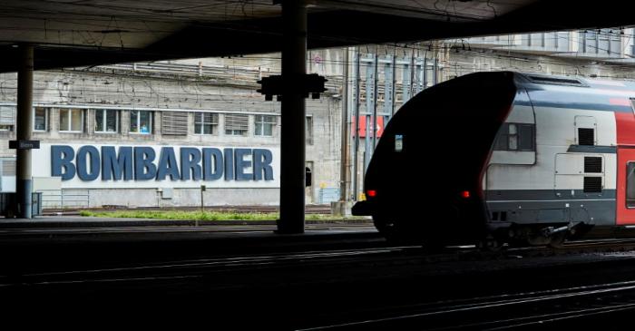 A Bombardier advertising board is pictured in front of a SBB CFF Swiss railway train at the