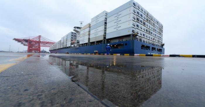 FILE PHOTO:  Container ship departs from a port in Taicang