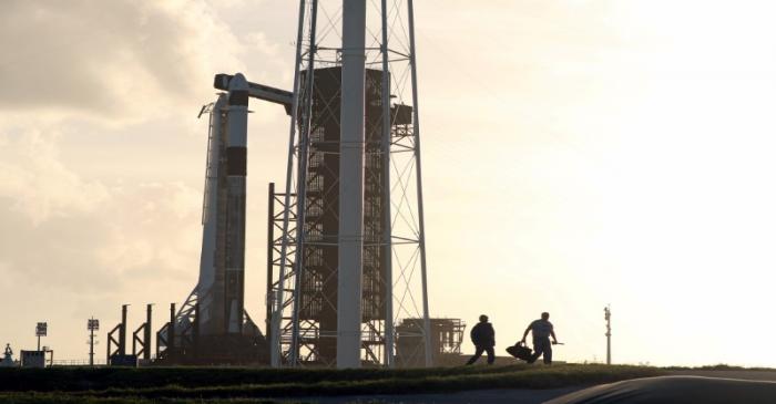 The SpaceX Crew Dragon sits atop a Falcon 9 booster rocket on Pad 39A at Kennedy Space Center