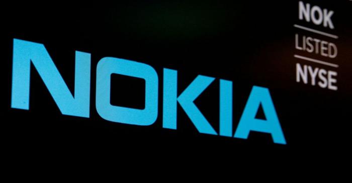 FILE PHOTO: The logo and ticker for Nokia are displayed on a screen on the floor of the NYSE in