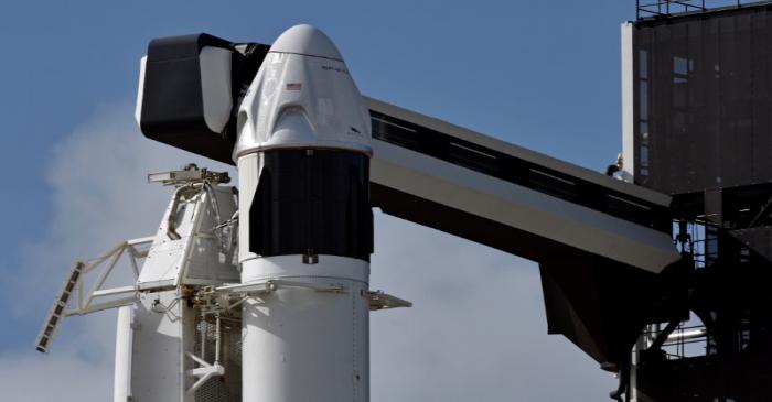 The SpaceX Crew Dragon capsule sits atop a Falcon 9 booster rocket on Pad 39A at Kennedy Space