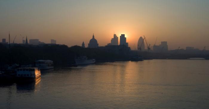 FILE PHOTO: The sun rises above the financial district of the City of London