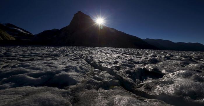 The sun rises behind the Konkordia Hut on the Aletsch Glacier