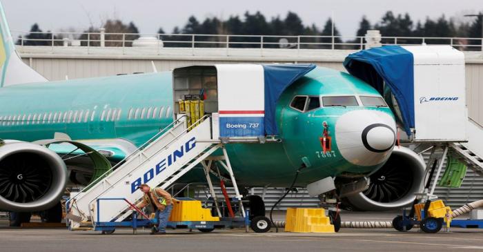 FILE PHOTO: An employee works near a Boeing 737 Max aircraft at Boeing's 737 Max production
