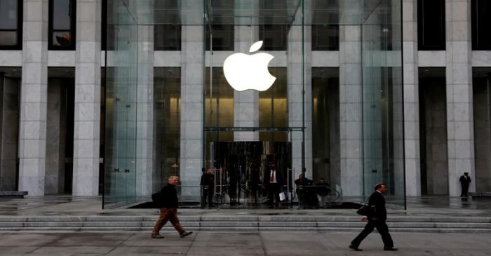 FILE PHOTO: The Apple Inc. logo is seen hanging at the entrance to the Apple store on 5th