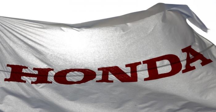 FILE PHOTO:  A flag with the company logo flies outside the Honda Motor Co. plant in Yorii