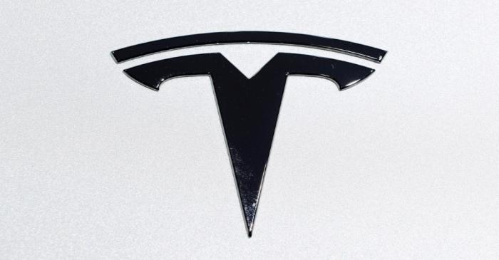 FILE PHOTO: Tesla logo is pictured on an electric car at Brussels Motor Show