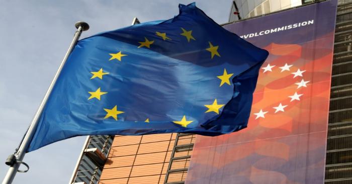 A European Union flag flies outside the European Commission headquarters in Brussels