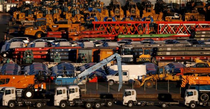 FILE PHOTO: Newly manufactured vehicles await export at port in Yokohama