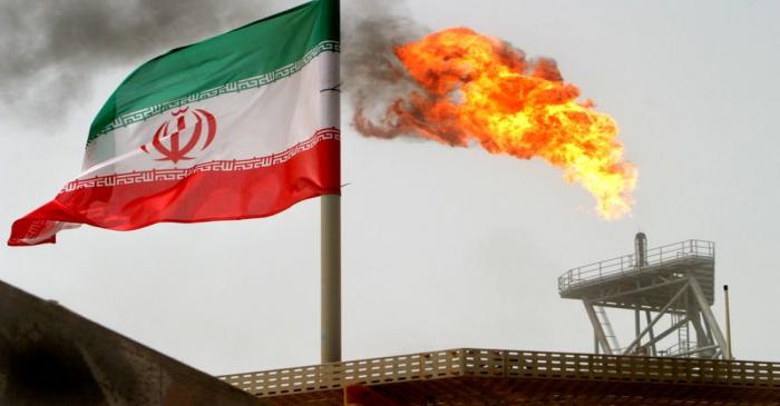A gas flare on an oil production platform in the Soroush oil fields is seen alongside an