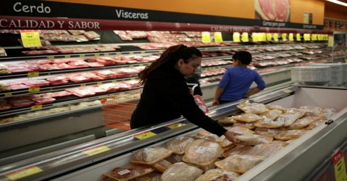 FILE PHOTO: A woman selects food at a supermarket in Ciudad Juarez,