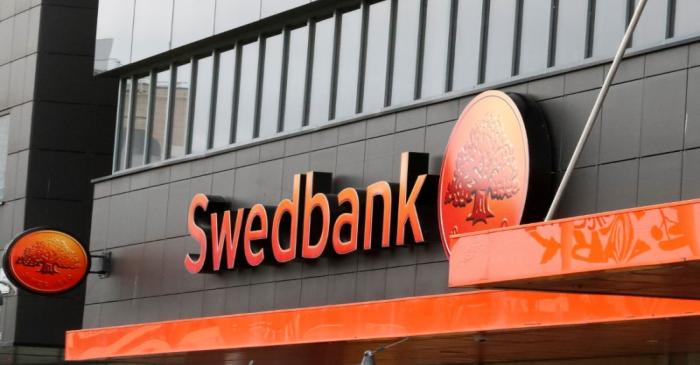 FILE PHOTO: Swedbank sign is seen on the bank's building in Tallinn