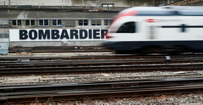 A Bombardier advertising board is pictured in front of a SBB CFF Swiss railway train at the