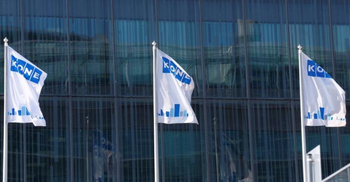 FILE PHOTO: Finnish company KONE flags flutter at their headquarters in Espoo
