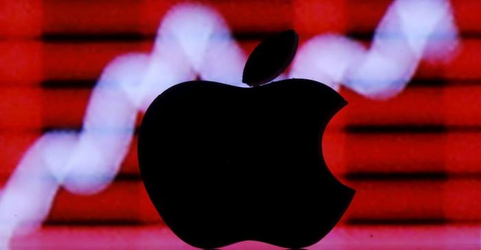 FILE PHOTO: Picture illustration of a 3D printed Apple logo in front of a displayed stock graph