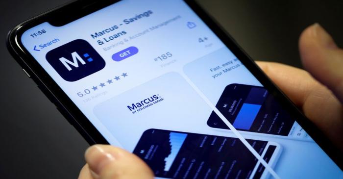 FILE PHOTO: A woman looks at Marcus, a new savings and loans app recently launched by Goldman