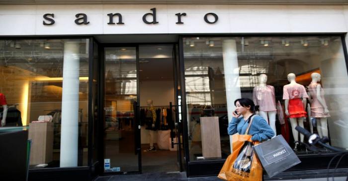The logo of ready-to-wear Sandro brand is seen on a fashion shop storefront in Paris