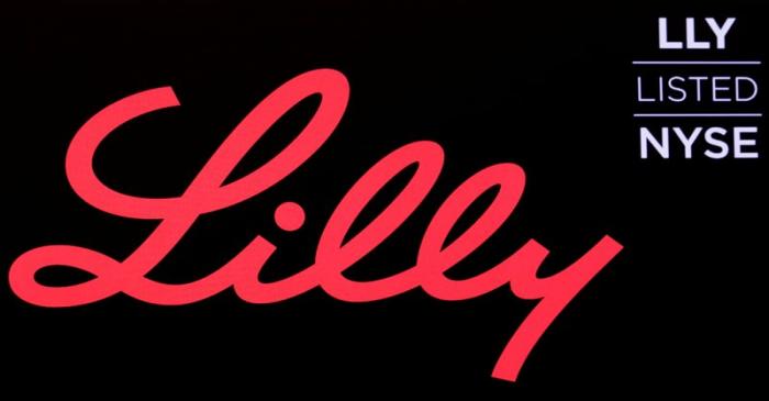 The logo and ticker for Eli Lilly and Co. are displayed on a screen on the floor of the NYSE in