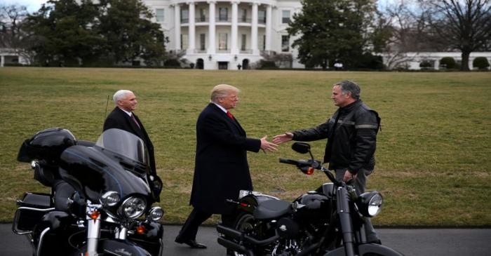 FILE PHOTO: U.S. President Donald Trump shakes hands with Matthew S Levatich, CEO of Harley