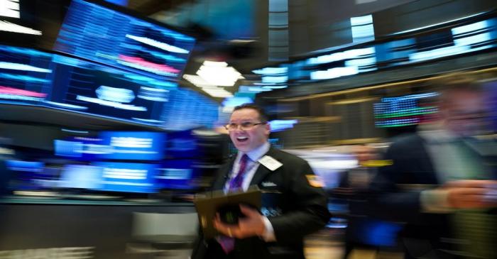 FILE PHOTO: A trader works at the New York Stock Exchange