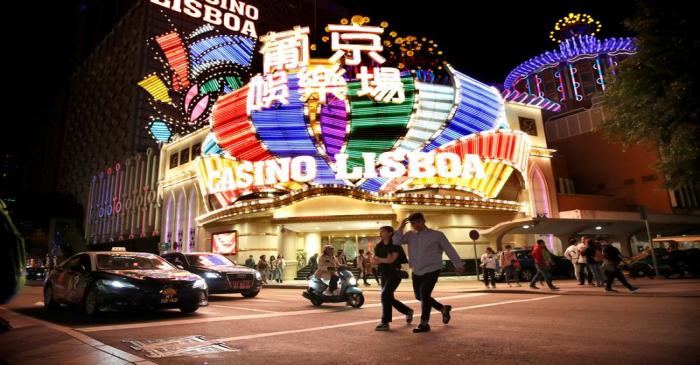 FILE PHOTO: People walk in front of Casino Lisboa in Macau