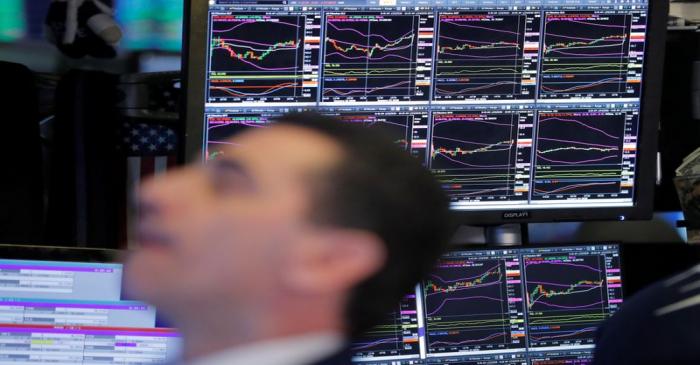 FILE PHOTO:  A trader works on the floor of the New York Stock Exchange shortly after the