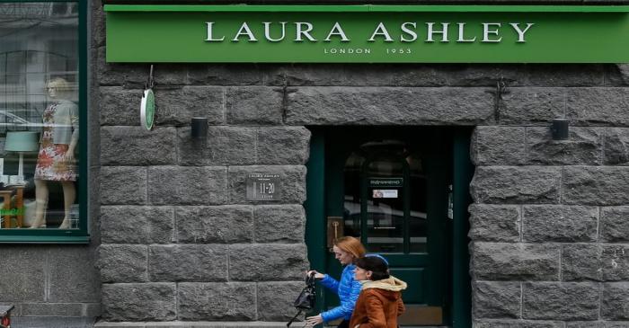 People walk past Laura Ashley store in Kiev