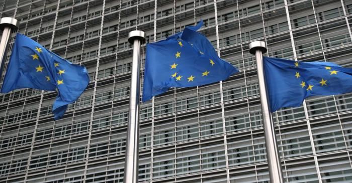 FILE PHOTO: European Union flags fly outside the European Commission headquarters in Brussels