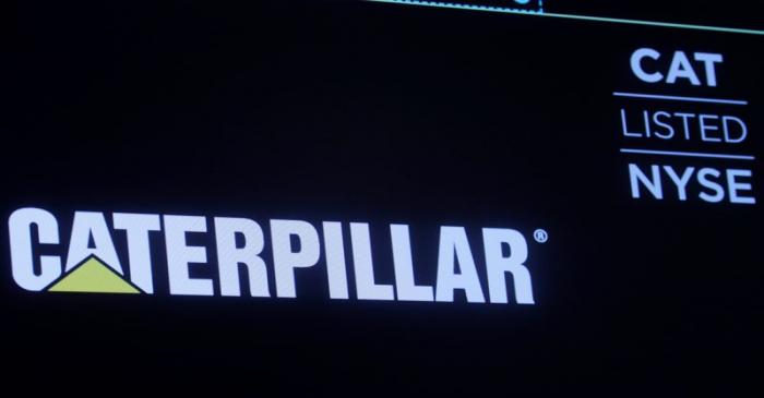 The company logo for Caterpillar Inc. is displayed on a screen at the NYSE in New York