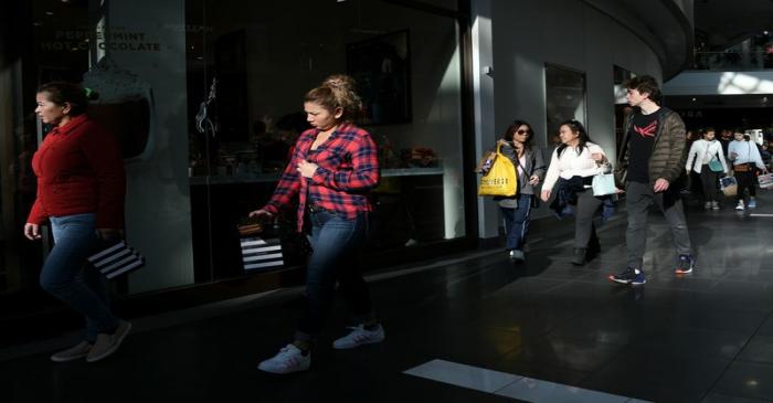 Holiday shoppers look for deals at the Pentagon City Mall in Arlington