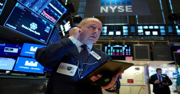 FILE PHOTO: A trader works at the New York Stock Exchange