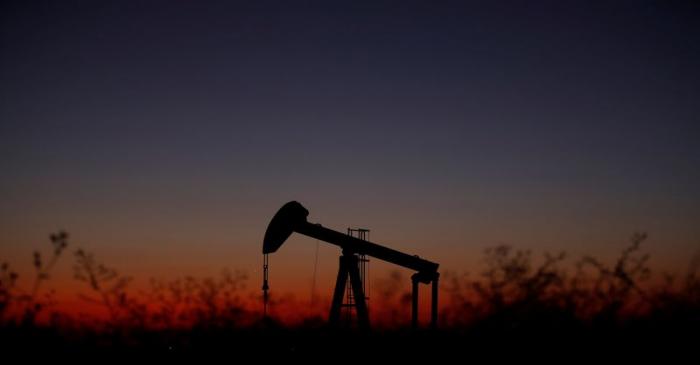 An oil pump is seen just after sunset outside Saint-Fiacre
