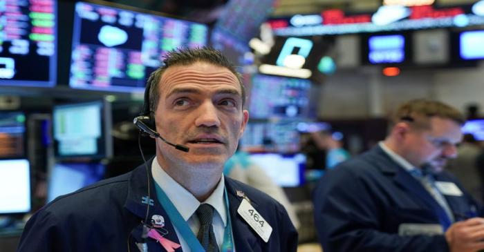 Traders work at the New York Stock Exchange