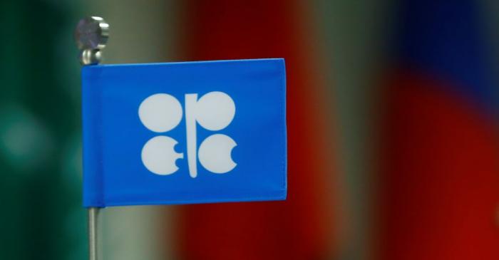 A flag with the Organization of the Petroleum Exporting Countries (OPEC) logo is seen  during a