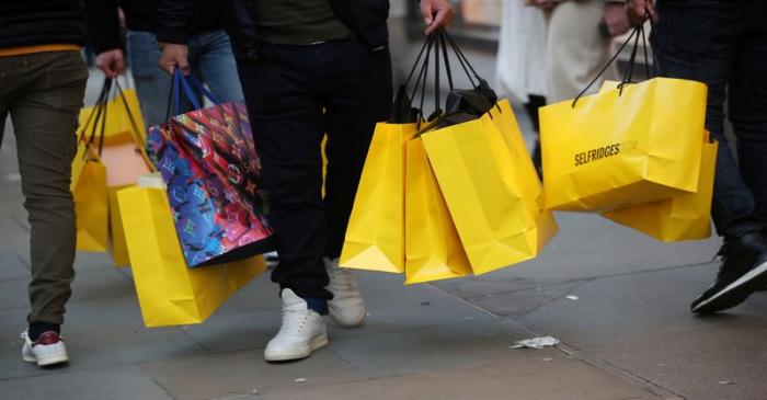FILE PHOTO: Shoppers walk along Oxford Street in London