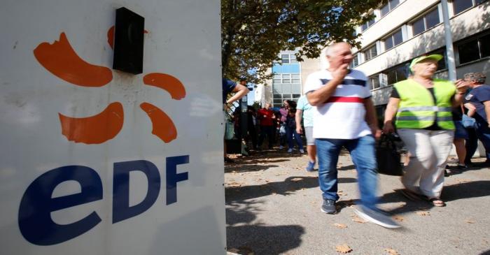 Employees of France's EDF energy company attend a demonstration against the announced 
