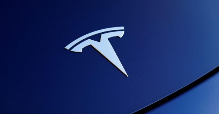FILE PHOTO: The front hood logo on a 2018 Tesla Model 3 electric vehicle is shown in Cardiff,