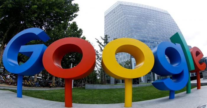 FILE PHOTO: The brand logo of Alphabet Inc's Google is seen outside its office in Beijing