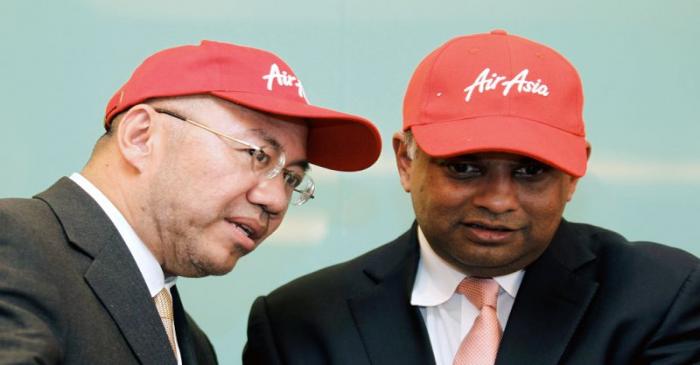 FILE PHOTO: AirAsia's Tony Fernandes and Kamarudin Meranun during news conference in Kuala