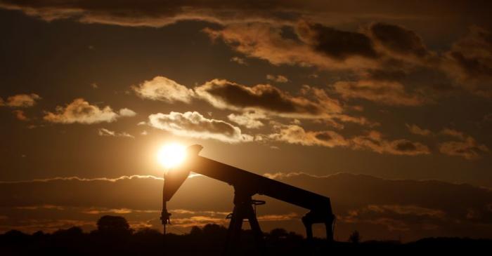 A pumpjack is seen at sunset outside Scheibenhard, near Strasbourg