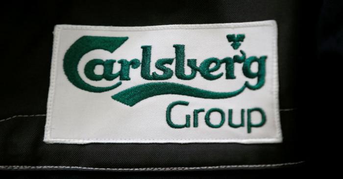 FILE PHOTO: The Calsberg's logo is seen on the jacket of an employee at the development center