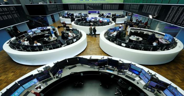 FILE PHOTO:  Traders work at Frankfurt's stock exchange in Frankfurt