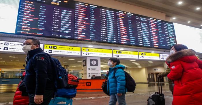 Passengers wear masks at Moscow's Sheremetyevo Airport